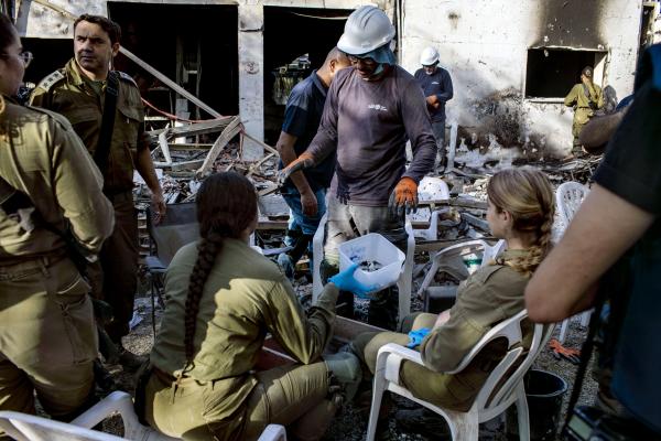 Image from The October 7th War -  IDF forensics teams working to identify the remains of...