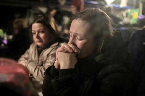 Ukraine-Russia War - Her sorrow clearly evident, a resident of Kyiv waits in...