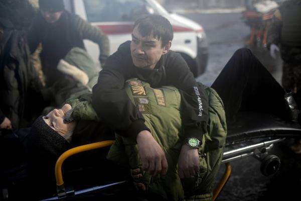 A volunteer keeps an elderly woman warm during the evacuation of civilians from Irpin city. Irpin became the site of a battlefield engagement during the Kyiv offensive. &nbsp;Russian forces took the Hostomel airport in the north of the city to facilitate an advance southwards, around Kyiv. The city was shelled by Russian artillery while the Ukrainians were able to repel and destroy multiple forces attempting to move into the town.