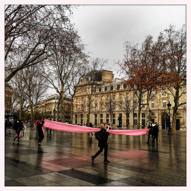 A pink banner is unfurled at Pa... violent attacks across France.