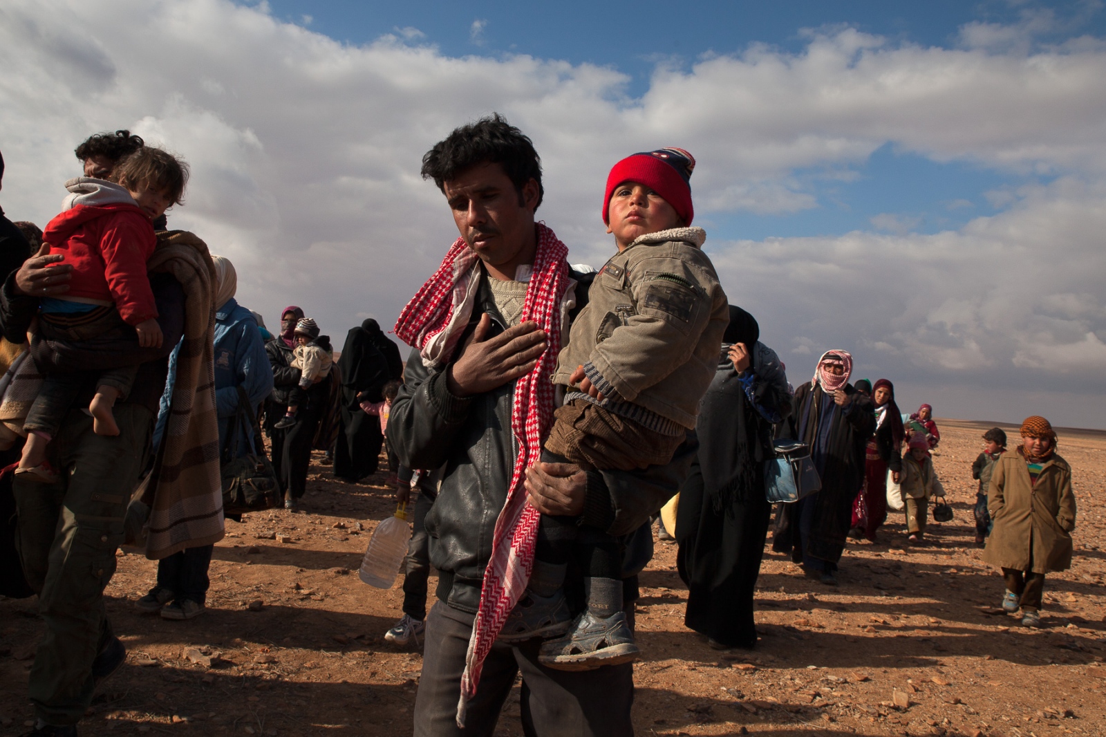 The Syrian Refugee Crisis - Some refugees paid hundreds of dollars to smugglers to...