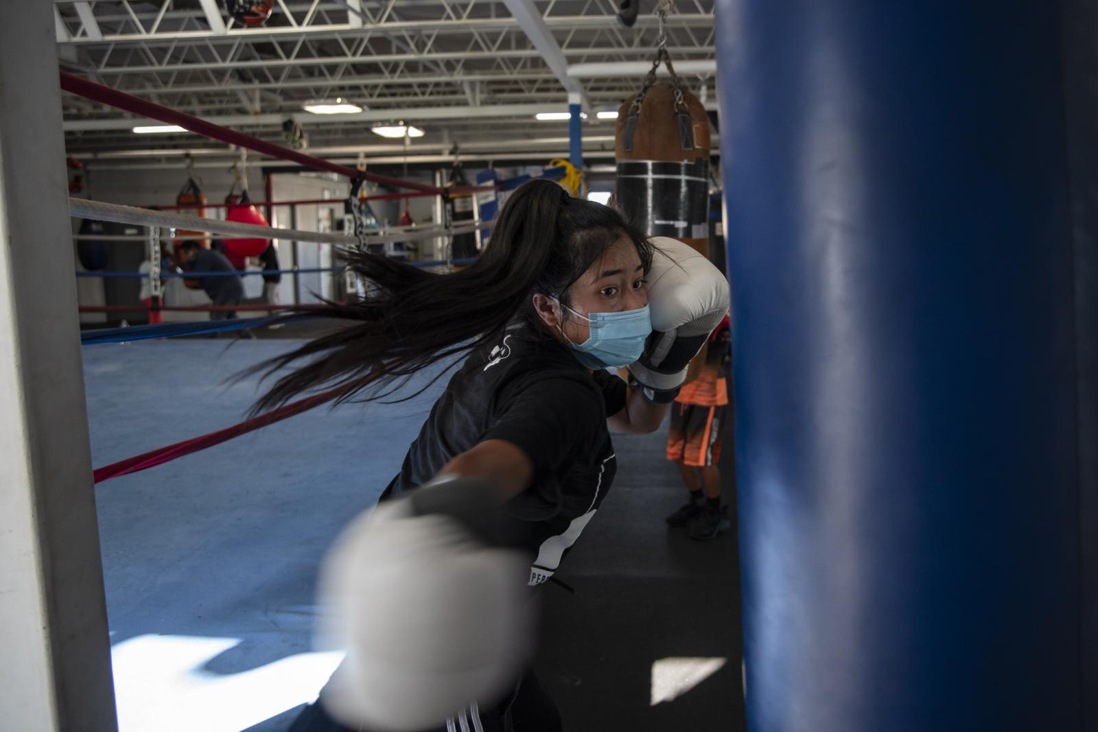 Naeli Garcia, 16, swings a righ...revent the spread of the virus.