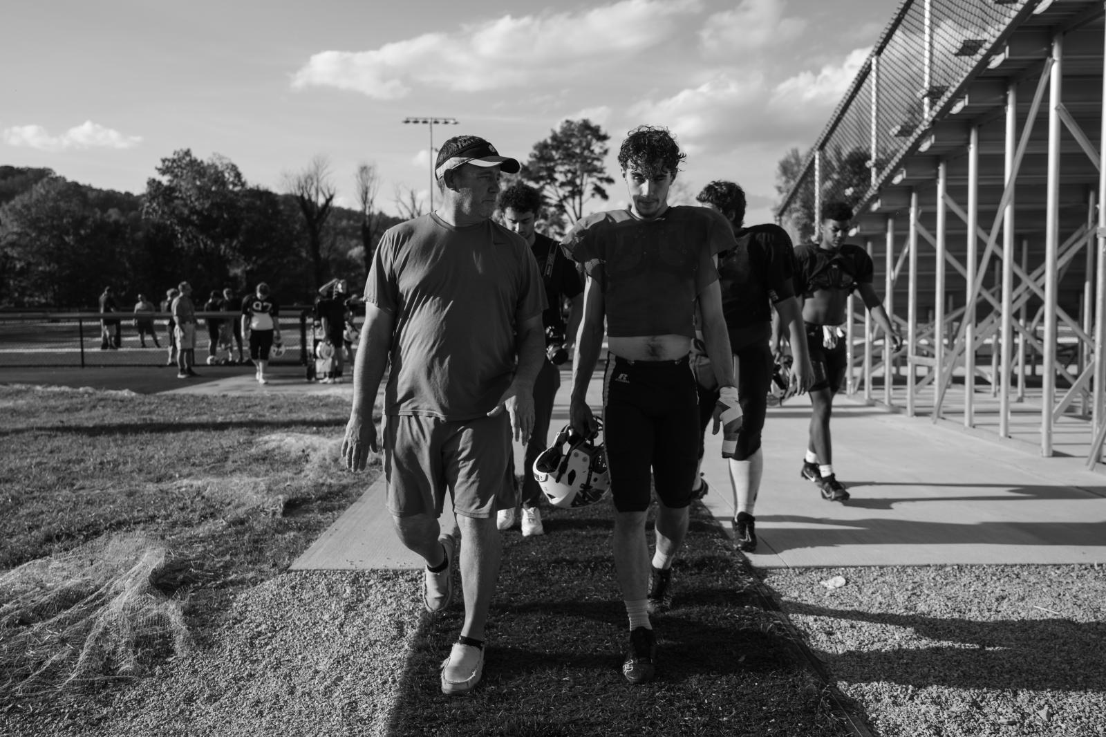 Kind Words, Big Differences - Vaughn walks with the Yellow Jackets&rsquo; starting quarterback Nate Goodin as they return...