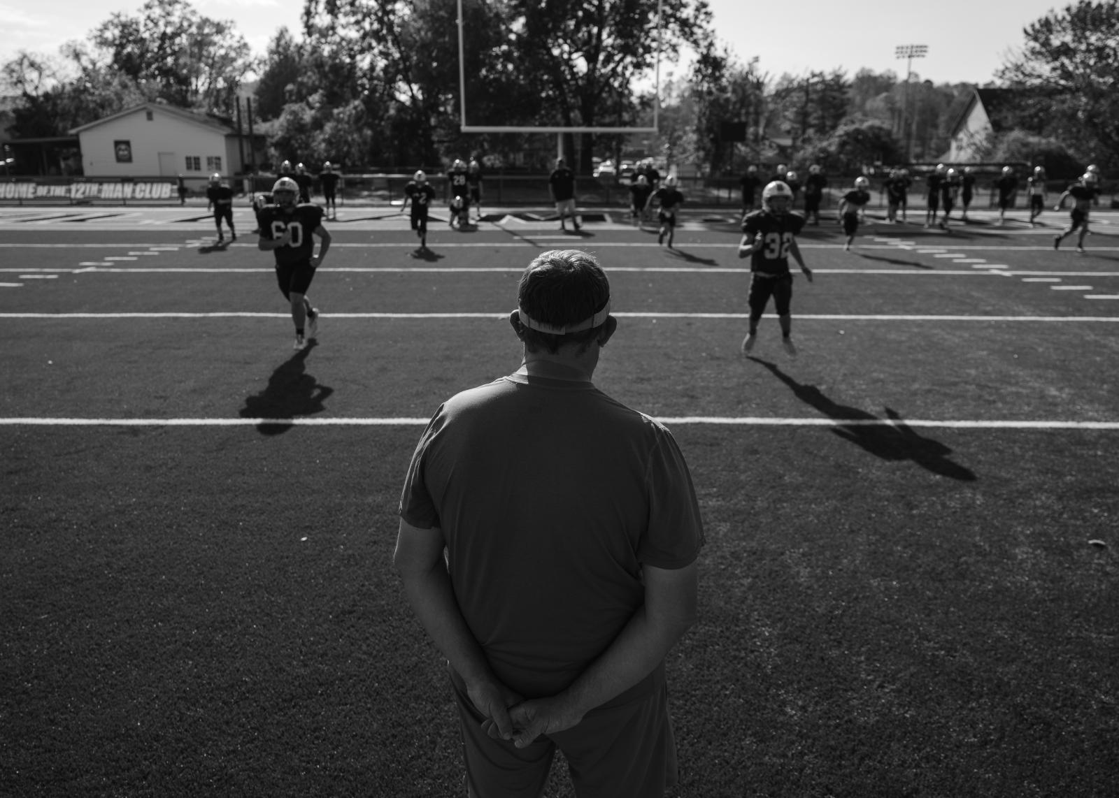 Kind Words, Big Differences - Vaughn looks out over his players as they run drills during practice in preparation for their...