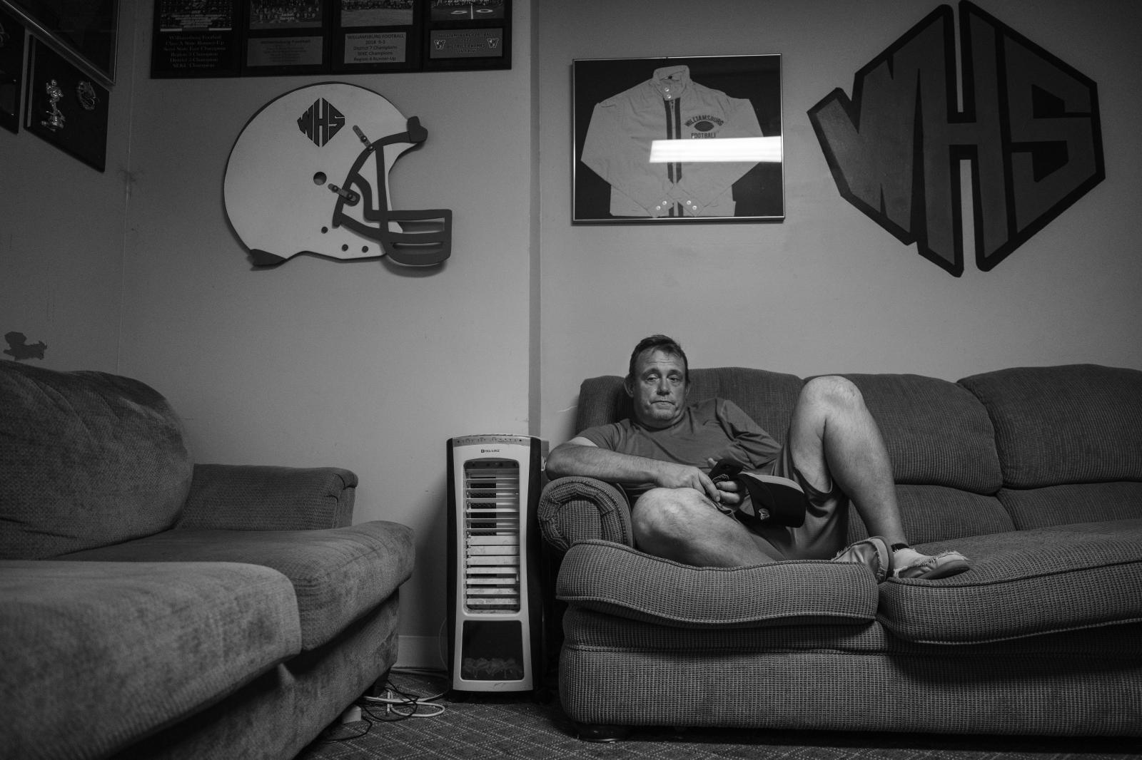 Kind Words, Big Differences - Vaughn rests in the Yellow Jackets field house after practice.