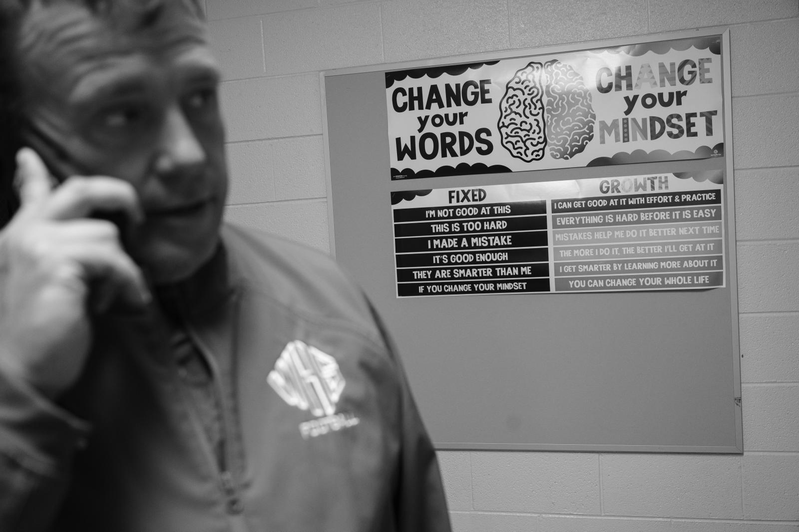 Kind Words, Big Differences - Vaughn answers a phone call between periods in the hallway outside his classroom.