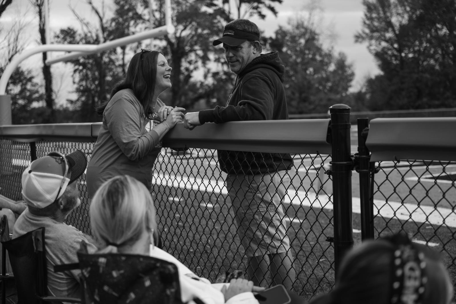 Kind Words, Big Differences - Amy and Vaughn share a moment before the start of the Yellow Jackets&#39; homecoming game....