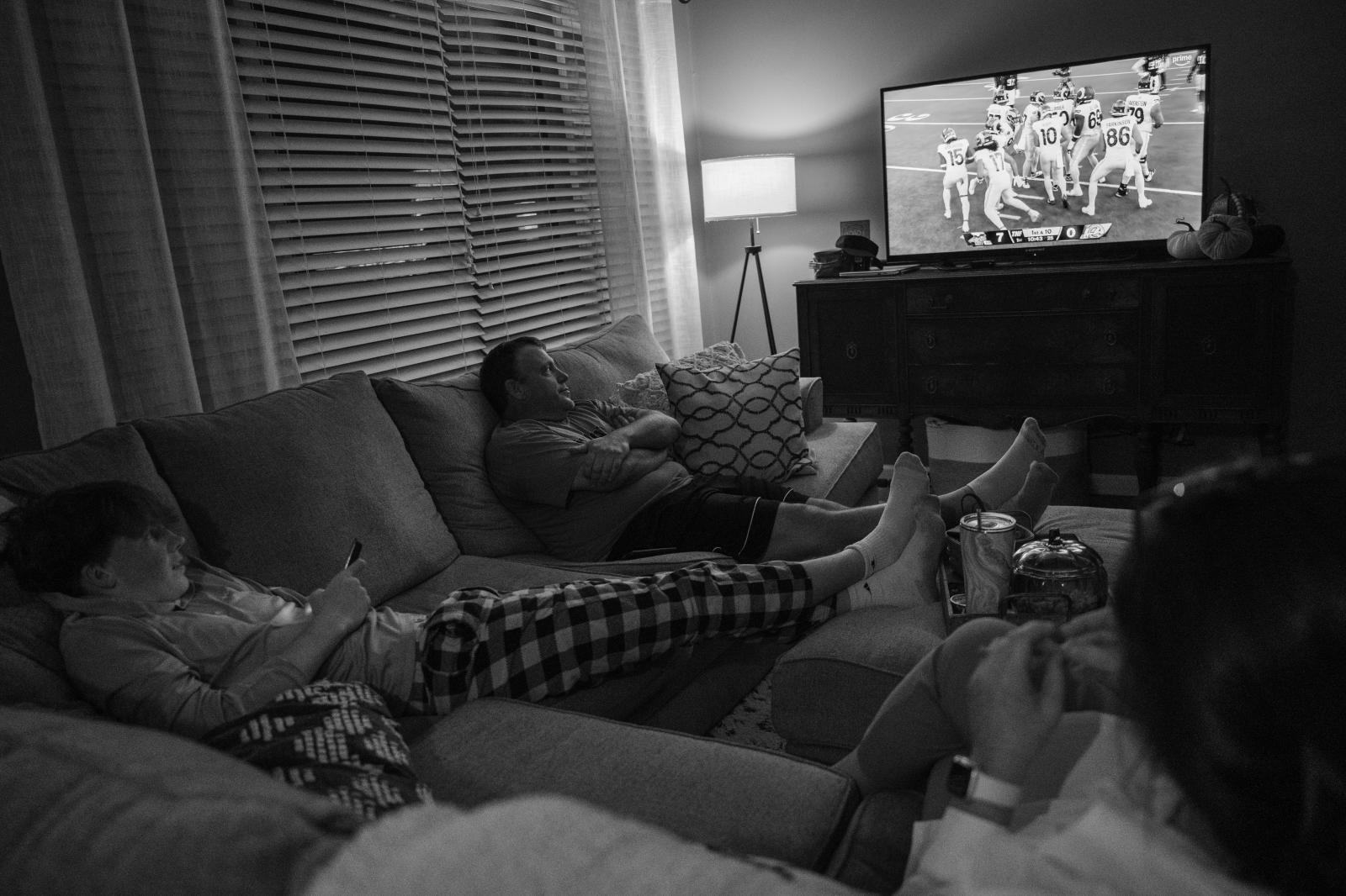 Kind Words, Big Differences - Amy, Vaughn and their youngest son, Reece, 15, watch a Thursday night football game while...