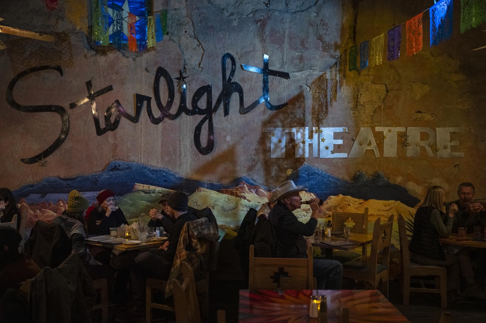 Diners sit for an evening meal ...el shops for tourists to enjoy.