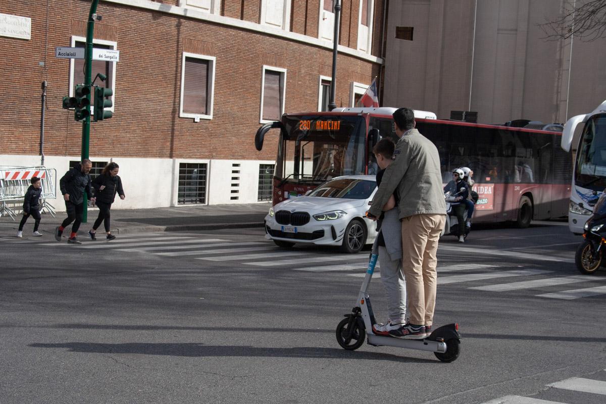 ROME: March 17, 2024. A man and...rider per scooter policy only. 