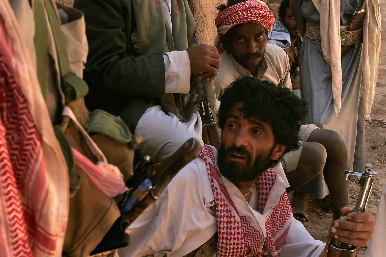 Yemen: Surviving Tribal Wars - Tribal guards keep an eye out at a border village in Al...