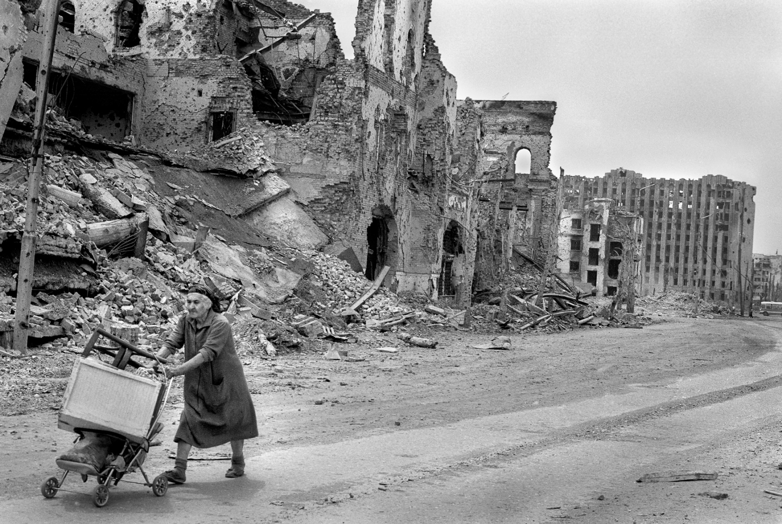Forgotten Wars - An elderly woman takes her belongings to find a new place...