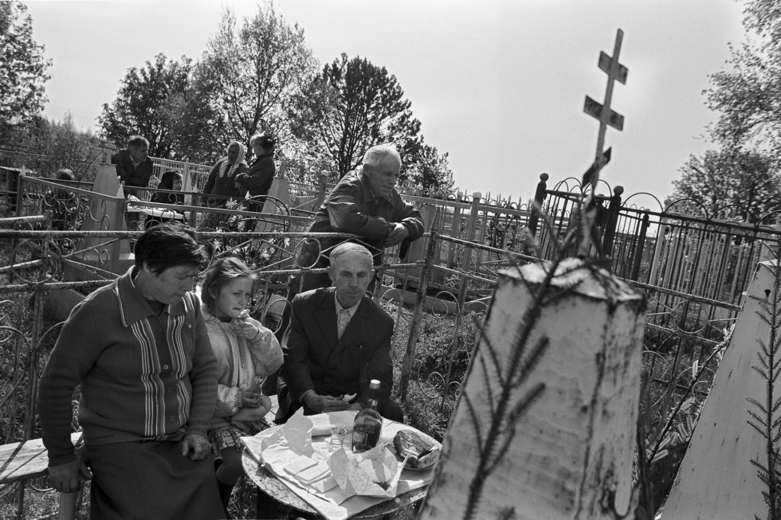 Russia - The Village of Anufrievo - Villagers honor the dead with food, drink, and impromptu...