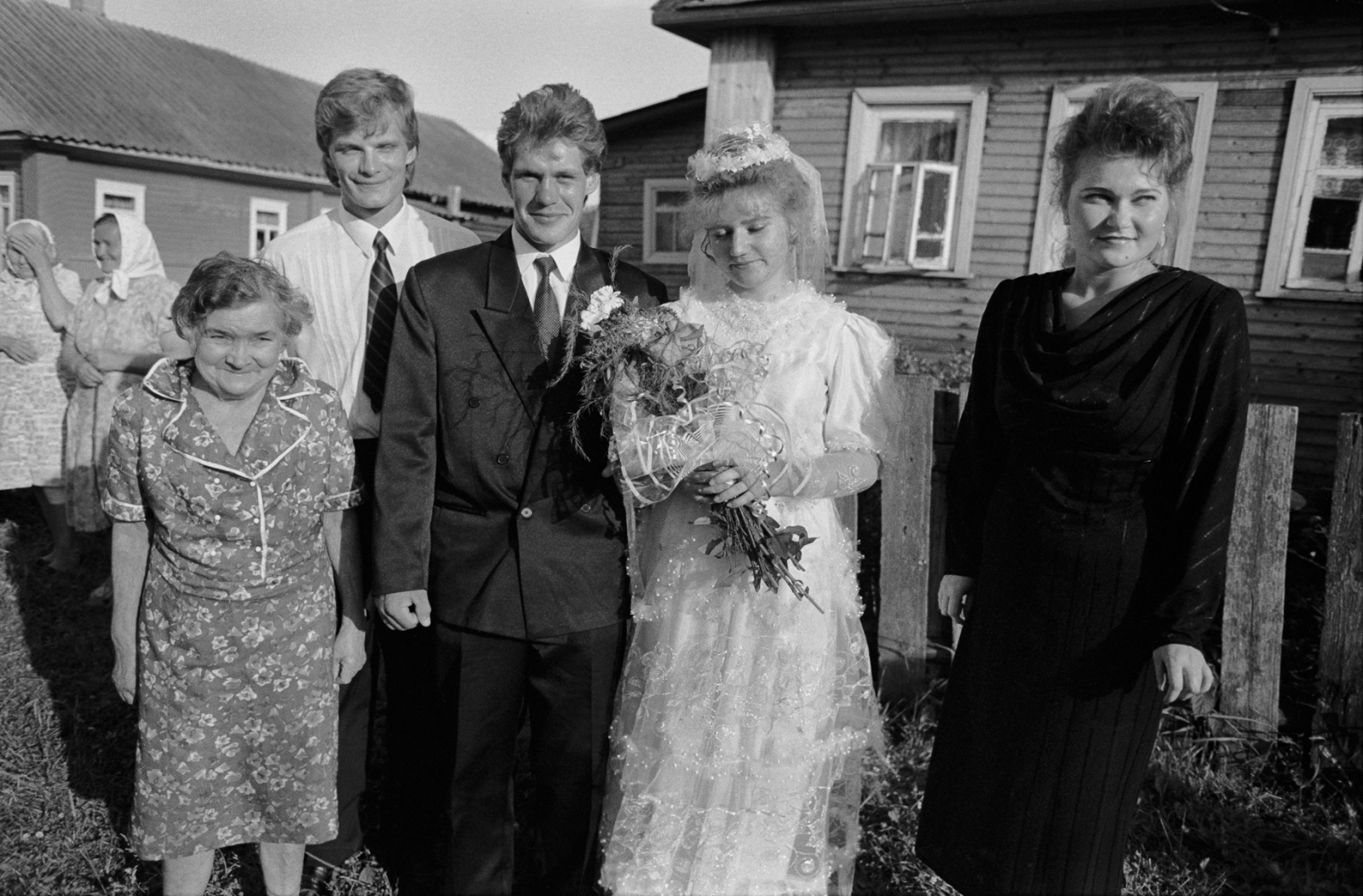 Russia - The Village of Anufrievo - Family members pose with the wedding couple.