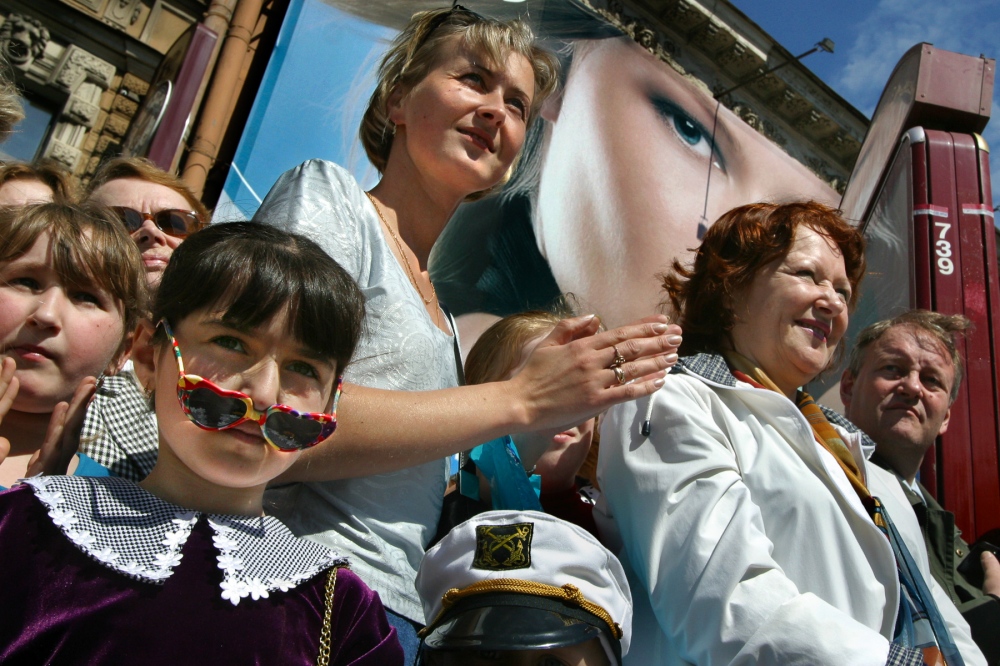  A festive crowd jams Nevsky Pr... the 350th anniversary parade. 