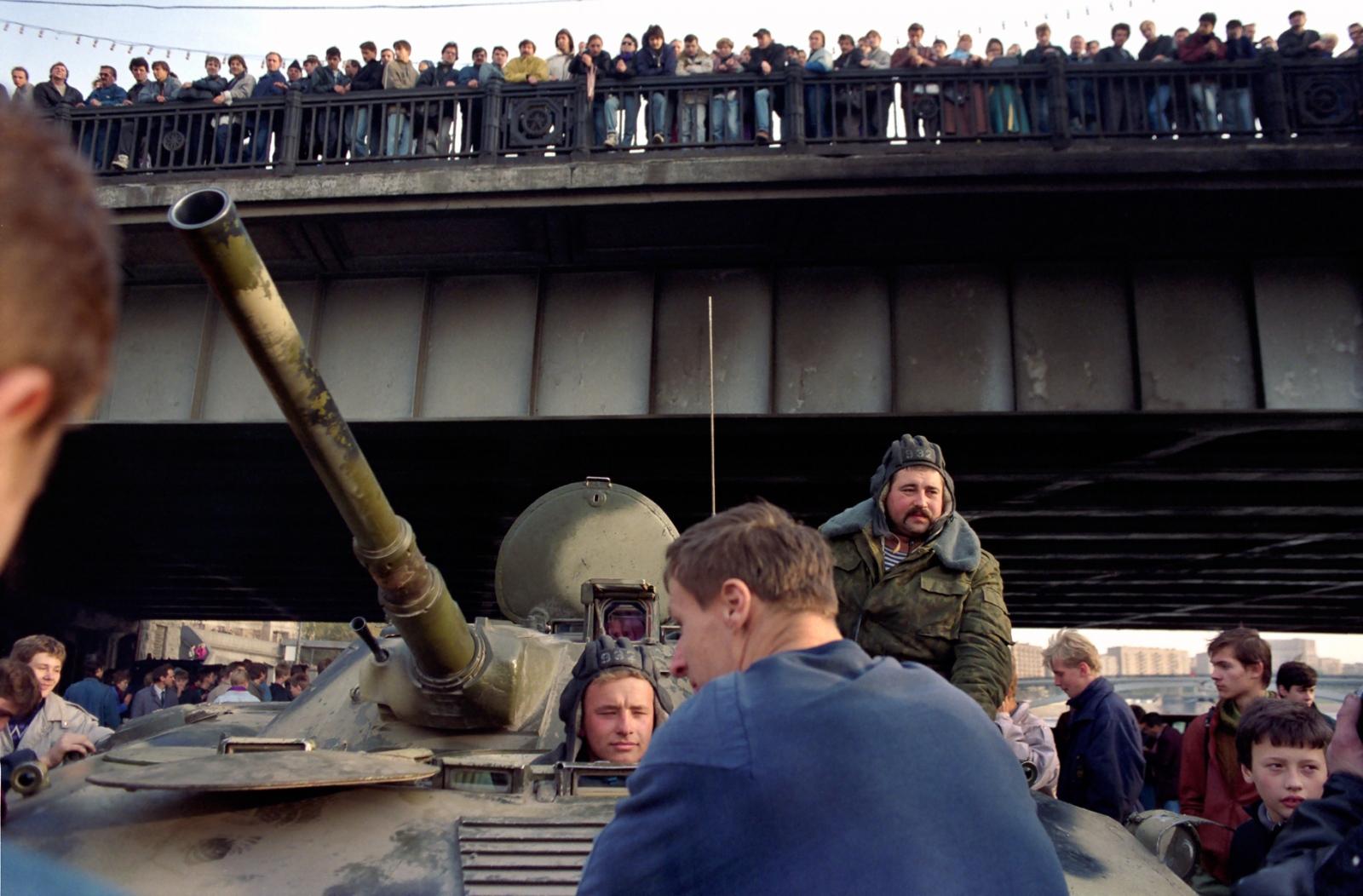 Bystanders watch as Russian troops take up positions around the White House of Russia parliament building during the 1993 constitutional crisis.