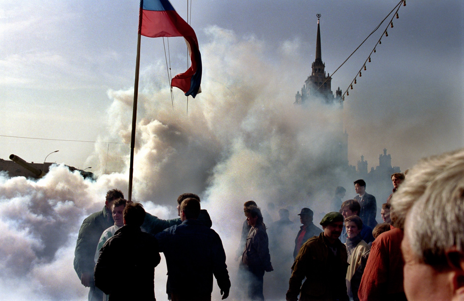 Russia In Transition - 1990s - Russians wave their flag as tanks head toward the White...