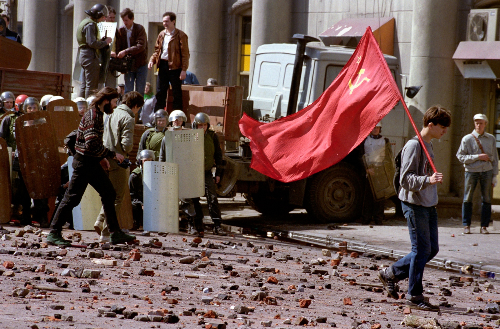 Russia In Transition - 1990s - A communist protester leaves the scene after a violent...
