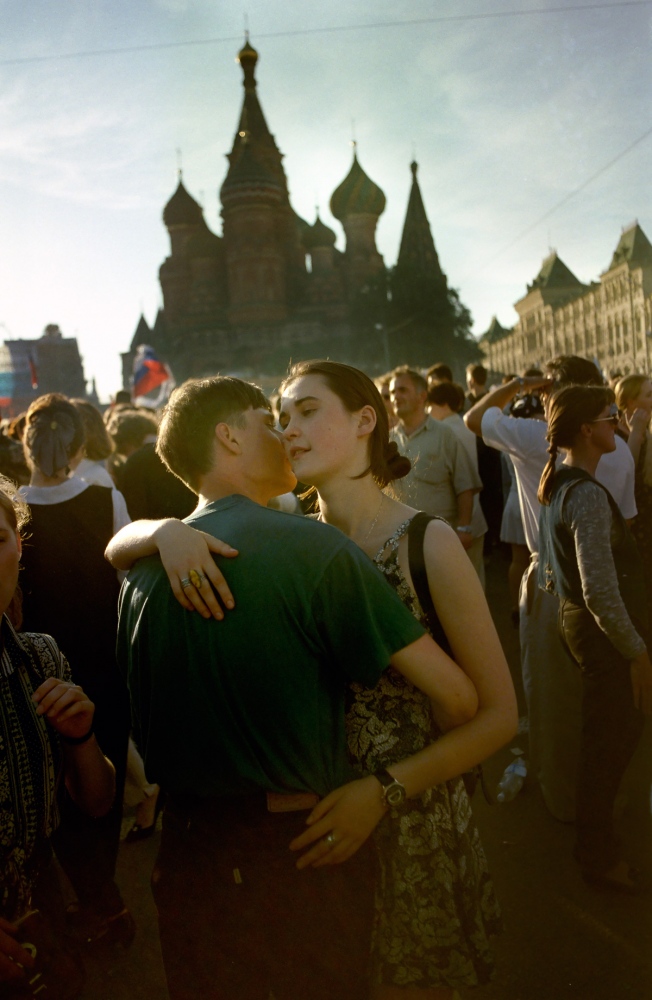 Russia In Transition - 1990s - A young couple hug after attending a rally in support of...