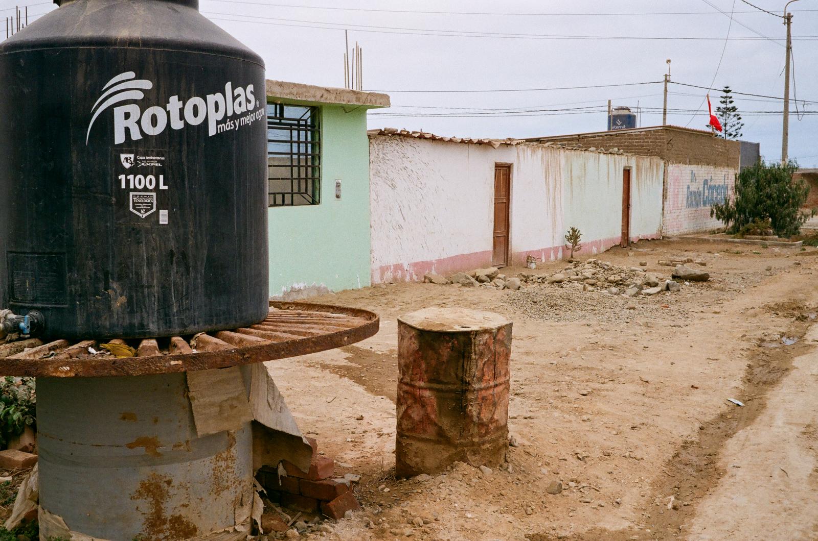 Drought -  A 1,100L water tank sits outside a residence in El Cerrito Huanchaco, a necessity for locals who...