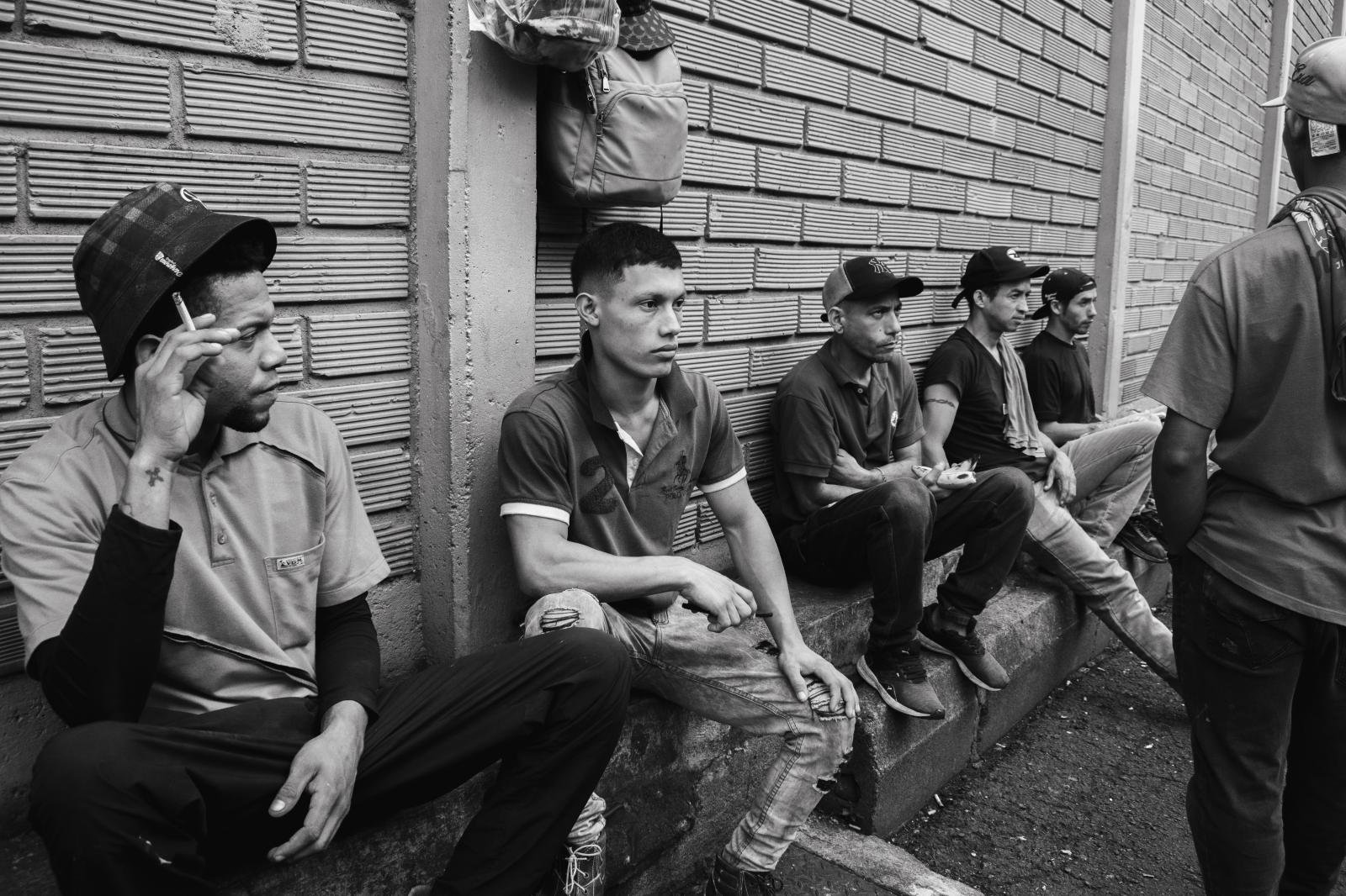 Carga: The Weight They Carry -  Sitting in exhaustion, these workers take their first break since 1 a.m. Their 12-hour shifts...