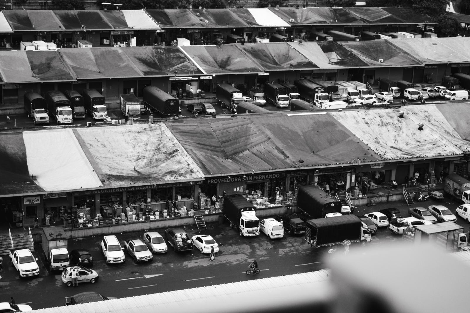Carga: The Weight They Carry -  Spanning 288,000 square meters, Plaza Mayorista is Medellín’s largest wholesale market - a...