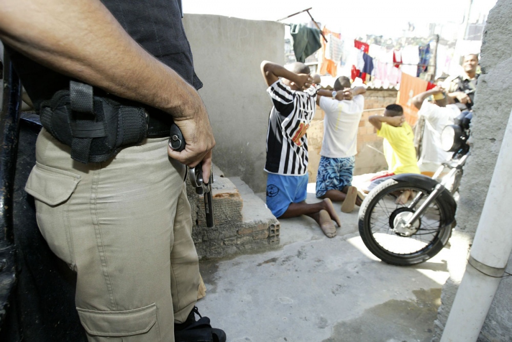 Image from Photojournalism -       Brazilian military police squad round-up suspects...