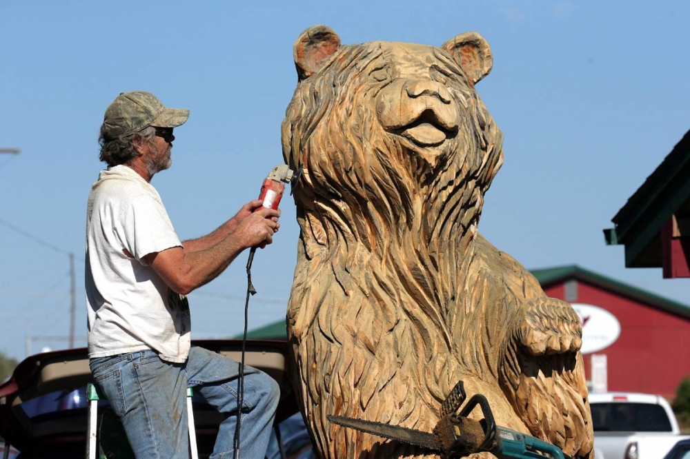  Don McAndrew sculpt a giant wood bear near Bozeman. Carved wood sculptures are common site throughout Montana. 