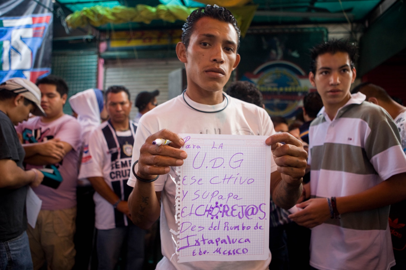 Sonideros | E- Book -  Fan holding his shout-out message written for Sonido...