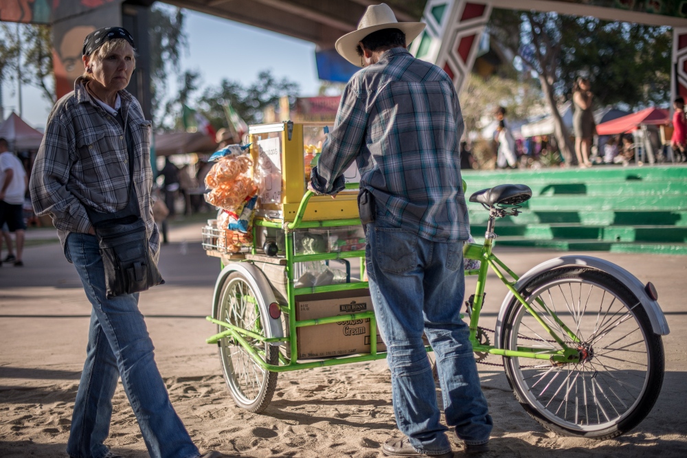 A paletero pushes his cart in f...ano Park Day on April 23, 2016.