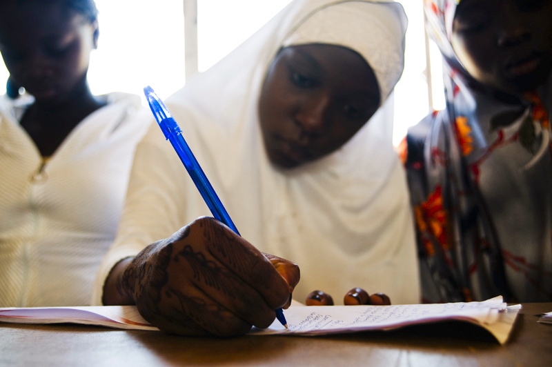  A participant takes notes during Girl Child Concerns annual "Life Skills Development and Mentoring Workshop" at Queen Amina College. Kaduna, Nigeria 2009 