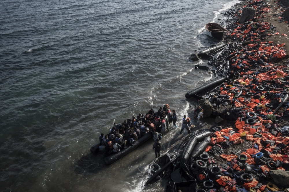  A small rubber dinghy filled w...es arrive from Turkey in 2015. 