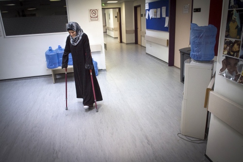  AMMAN, JORDAN-JANUARY 11: Syrian refugee Saha at MSF&#39;s (M&eacute;decins Sans Fronti&egrave;res/Doctors Without Borders) Hospital for Reconstructive Surgery in Amman, Jordan on January 11th 2016. Saha was injured in her hand and leg from a blast from an artillery shell while sheltering in a suburb of Aleppo in 2012. MSF opened the Al Mowasah Hospital in Tirmizi Street, Amman on the 8th September 2015. It is the first fully-fledged medical facility devoted solely to reconstructive surgery, physiotherapy and psychological support for victims of war. The Hospital is unique in offering a comprehensive care package free for its patients. It is the societies biggest single annual financial commitment with an expense of approximately &pound;7.5 million per year (2016) and a departure from its classical solely disaster response role towards one that offers &quot;rebuilding lives&quot;. (Photo by Craig Stennett/Getty Images) 