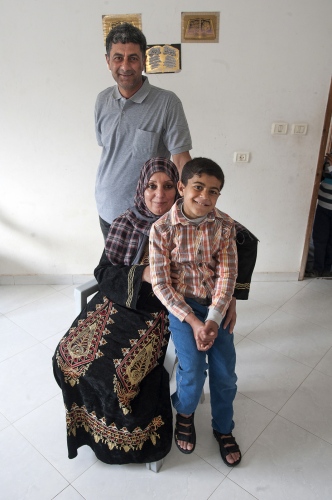   Abdel Motalib Awad at home with his parents. One year on from his Kidney Transplant.  