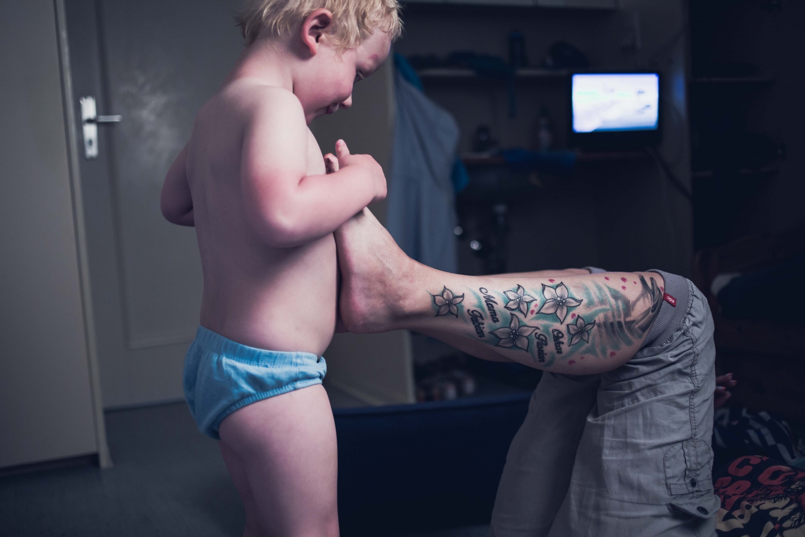 Breaking Free - Claudia B., 37, and her son Oskar, 3, play inside their...
