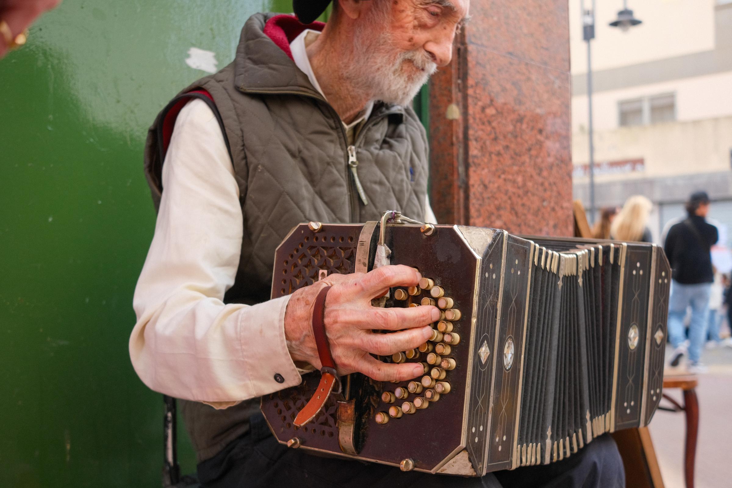Tango, Alma y ciudad - © Daniela Pallone A musician playing the 'Bandoneon' in the heart of San Telmo.