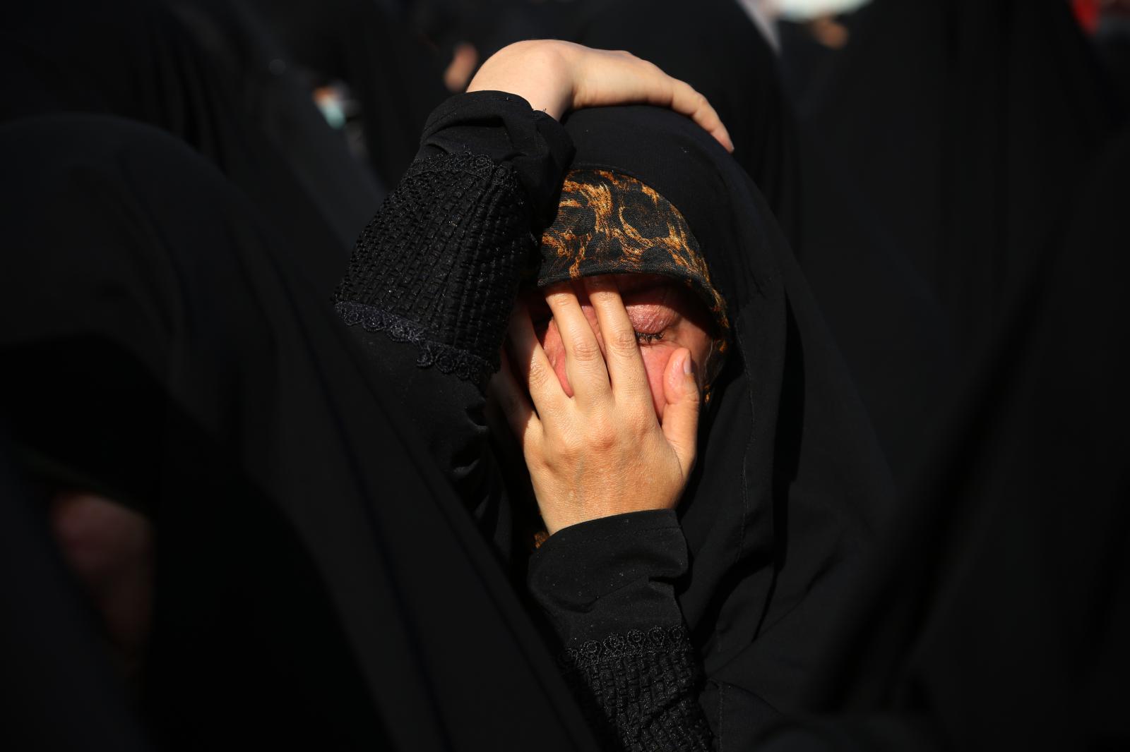 An Iranian veiled woman cries d...of public mourning. Tehran Iran