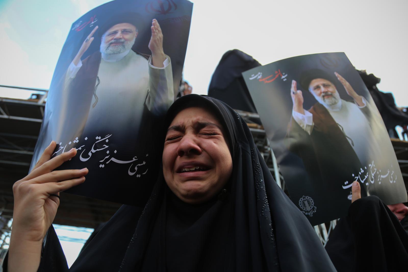 An Iranian veiled woman cries d...of public mourning. Tehran Iran