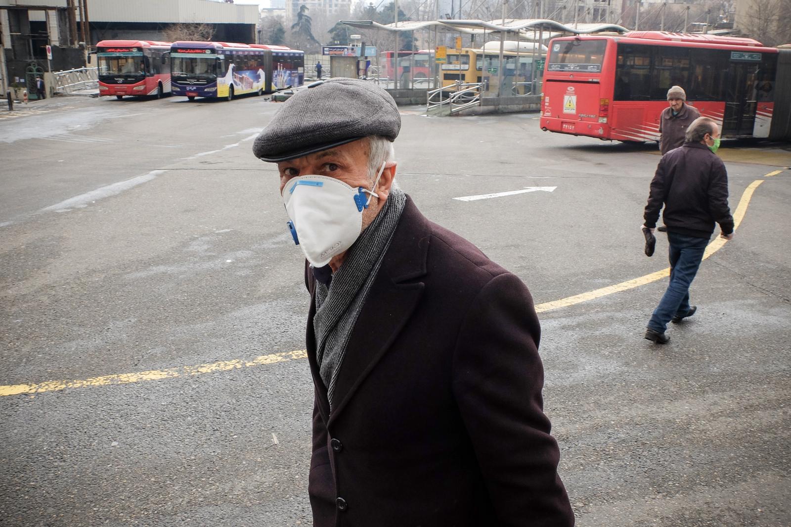 Iranians wearing face mask walk...Organization (WHO). Tehran Iran