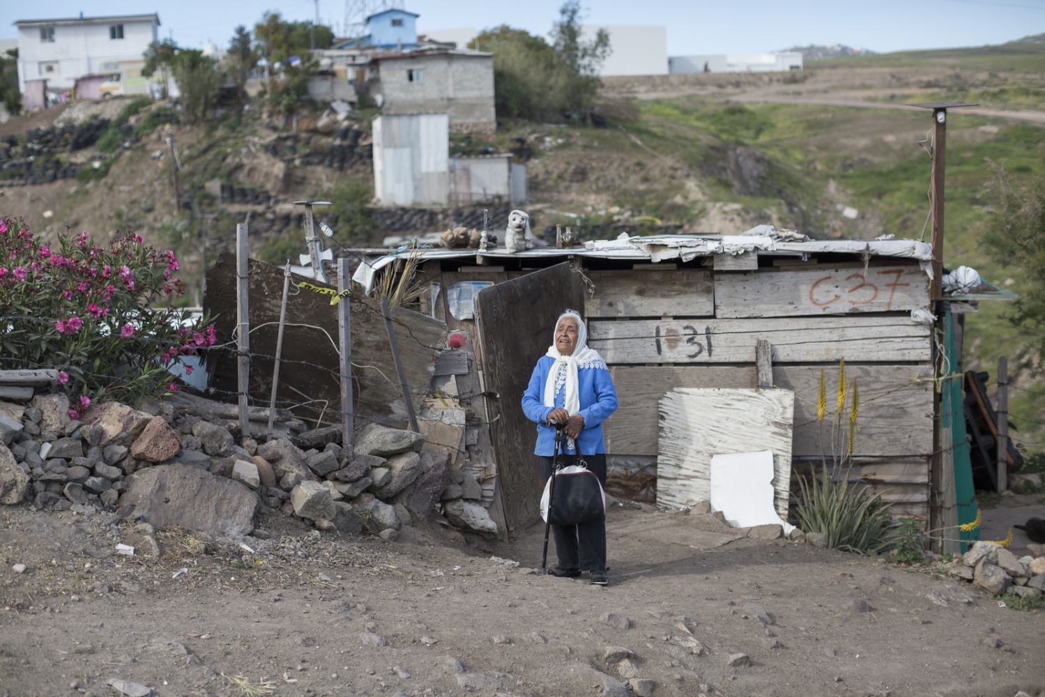 Alejandra Fuentes, 79, stands outside her humble residence in Rosarito. 