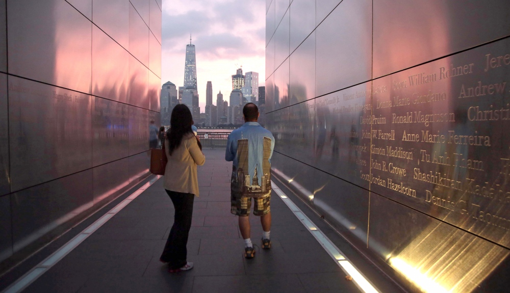   Steven Monetti Jr. and his fiancee Michelle Johnson walks through the Empty Sky Memorial in Jersey City on the morning of the 15th Anniversary of the September 11 attacks.&nbsp;  