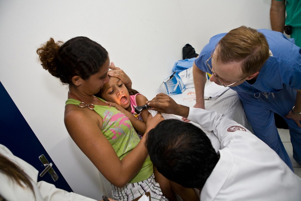 Evelyn being screened by Dr. Manoj Abraham and Dr. Alex Ovchinsky Aquiraz, Brazil, 2008   For Healing the Children Northeast  