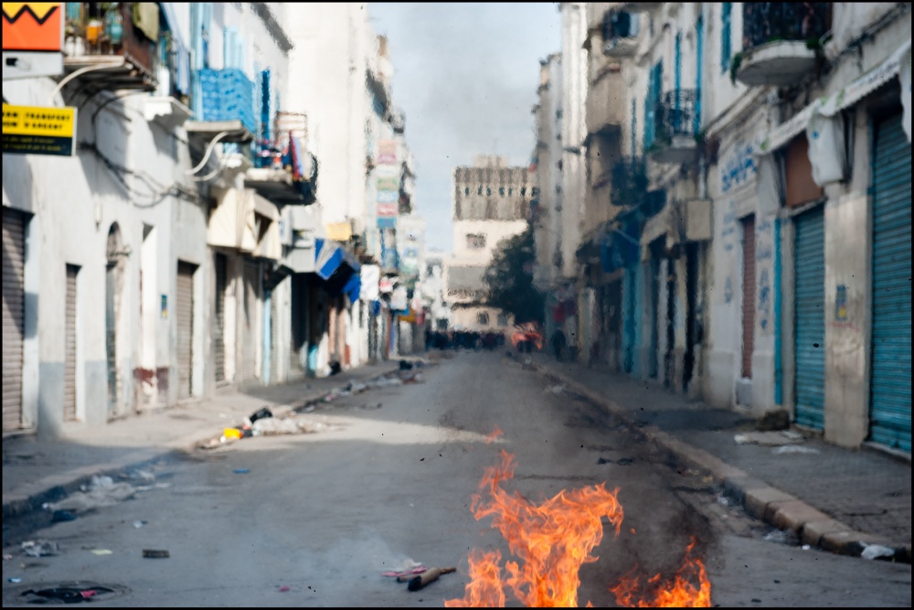Streets are burning as police f...testers in the centre of Tunis.