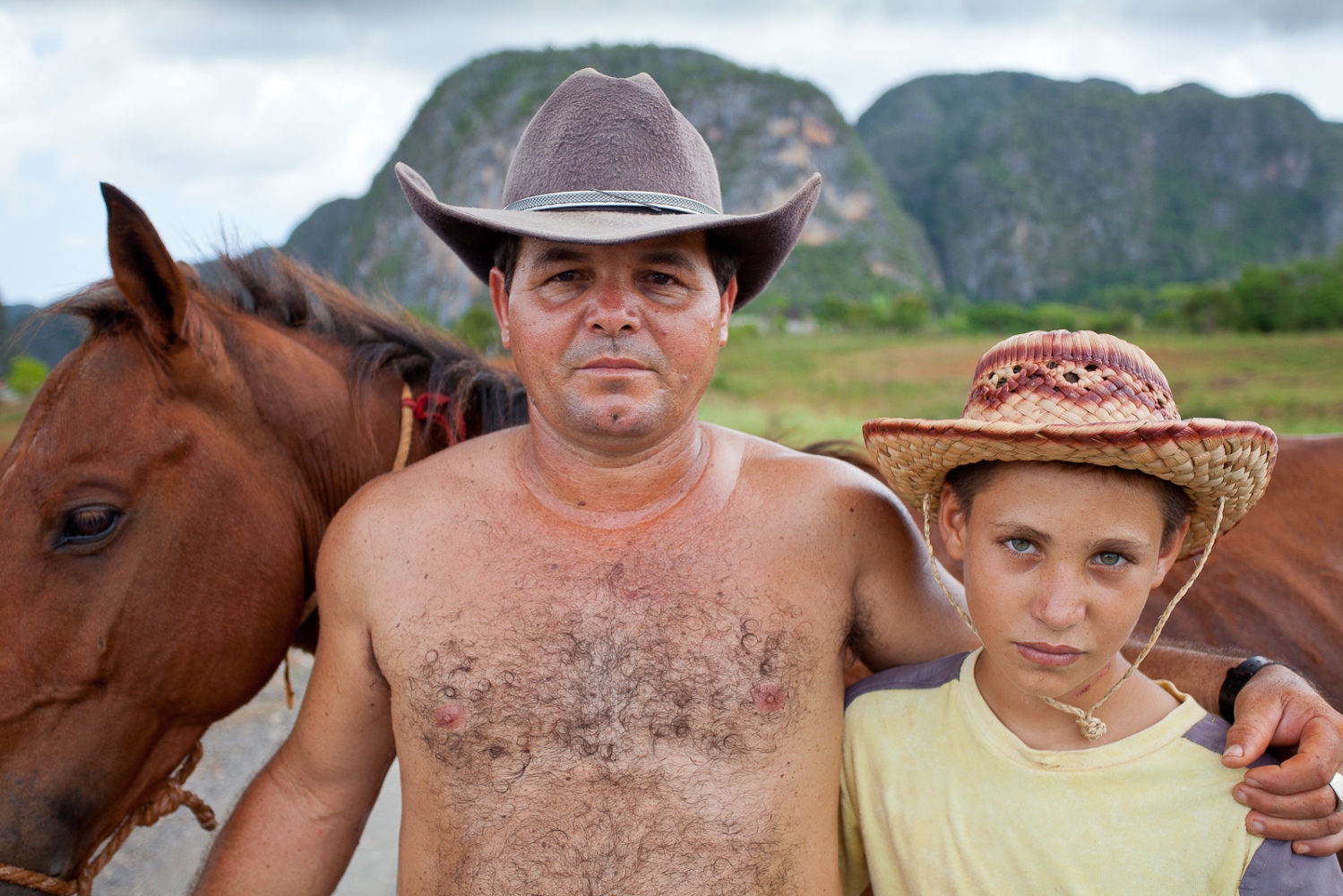 Island Out of Time -  Proud farmer with son in the tobacco region of the...