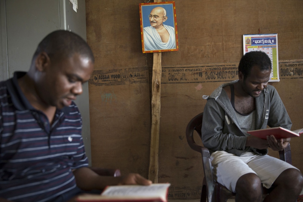  Head teacher Prakash Christian (left) and Mohan Sidi (right) take part in a bible reading...