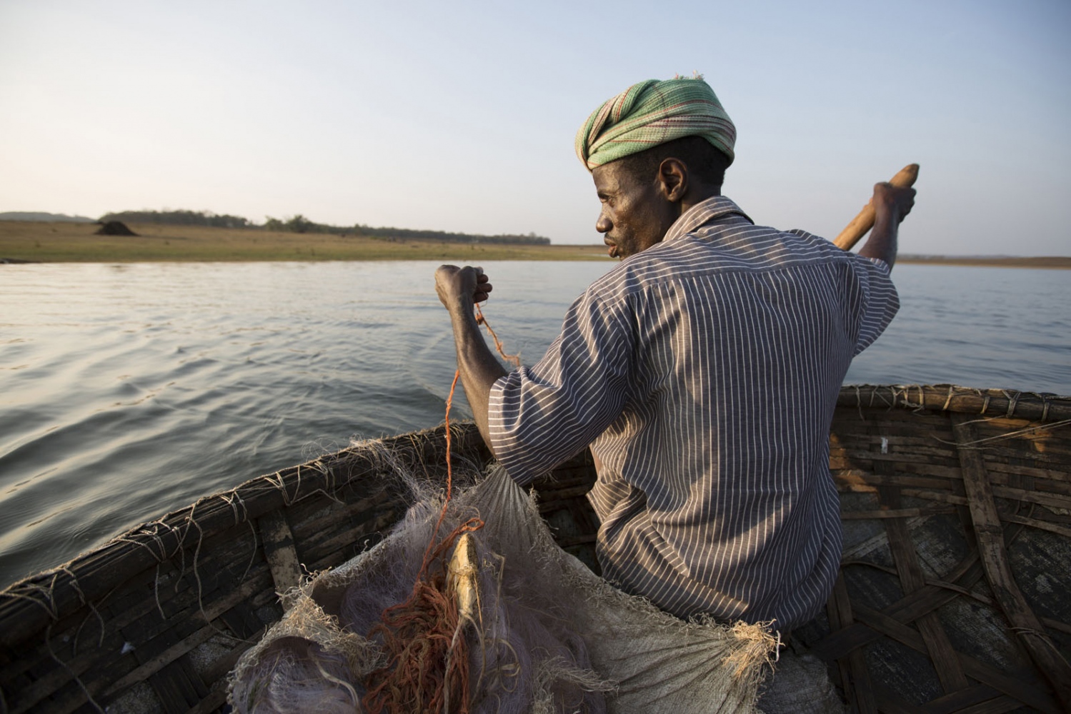 SOUTH ASIA'S AFRICAN DIASPORA -                                 A Sidi man fishes in a...