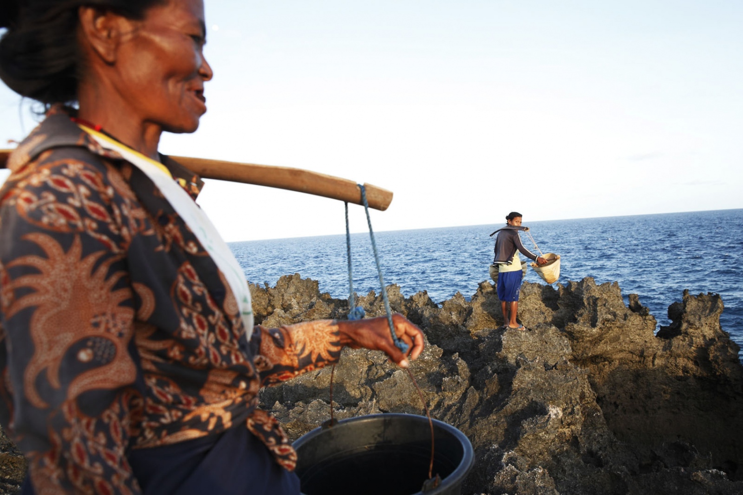 SALT - Women collect sea water that they will pour in to...