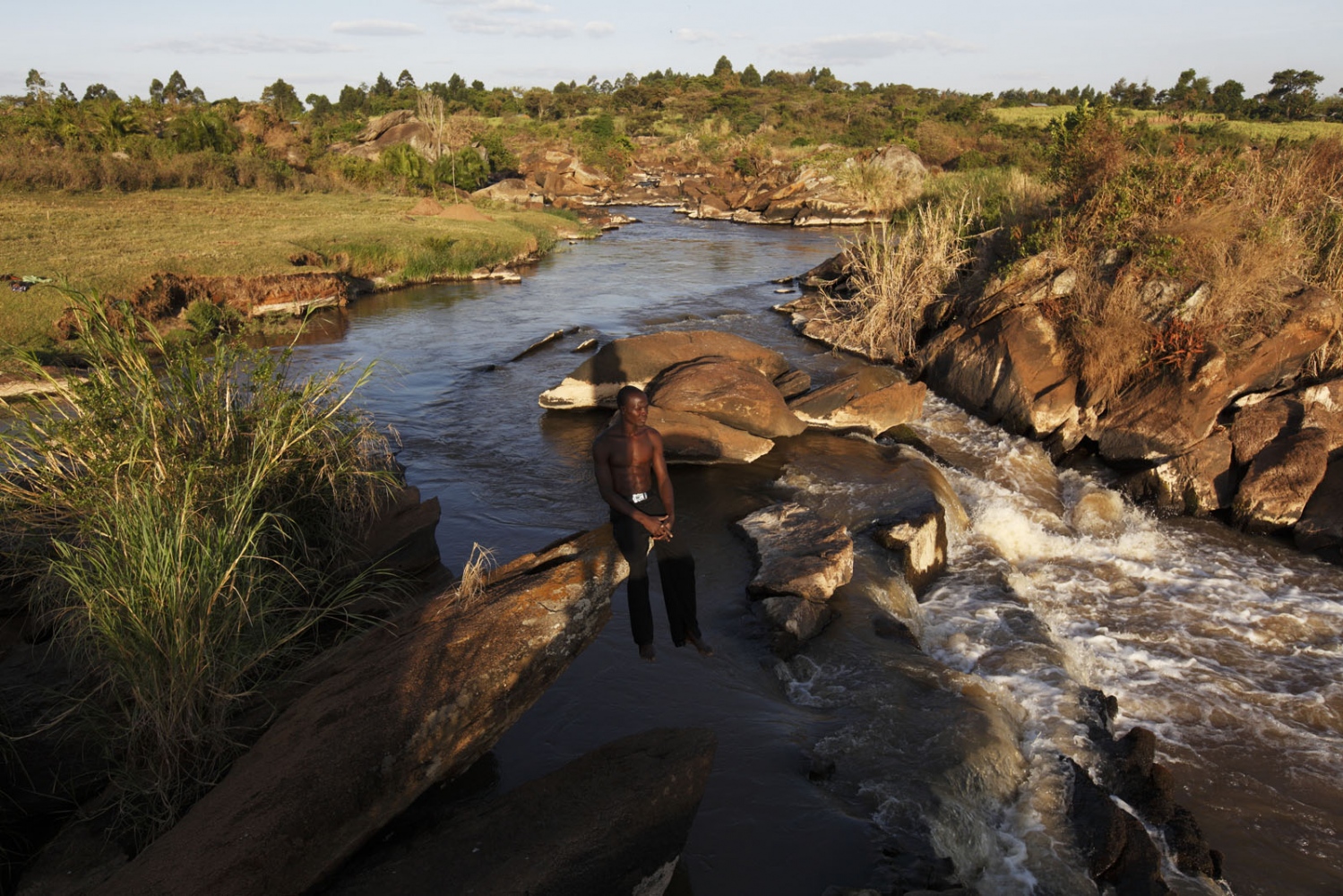 SALT - A salt maker sits and relaxes above the Nzoia River in...