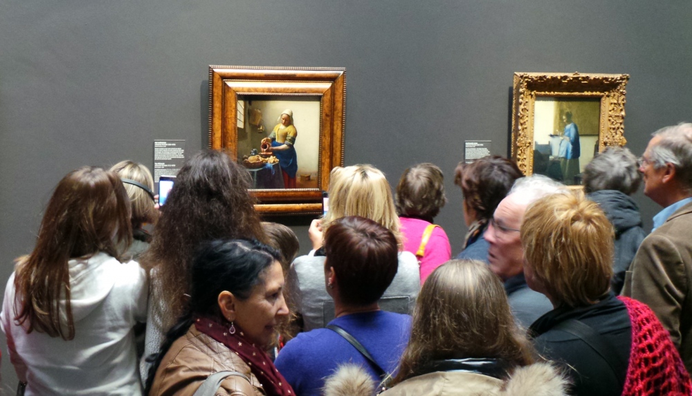  Crowds jostle for a look at Vermeer's The Milkmaid at the Rijksmuseum. 
