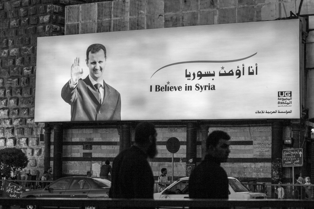 This massive billboards occupie...a historic wall. Damascus 2007.